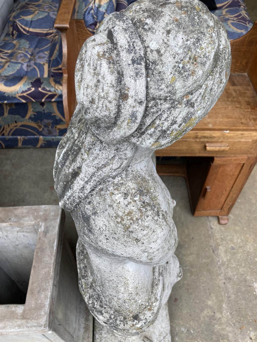 A reconstituted stone garden ornament of Venus on pedestal base, height 192cm